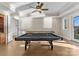 Spacious game room featuring a pool table and access to a large outdoor living area at 296 Windemere Isle Rd, Statesville, NC 28677