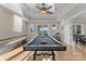 Game room featuring a pool table, shuffleboard, and access to the backyard at 296 Windemere Isle Rd, Statesville, NC 28677
