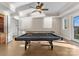 Game room featuring a pool table, shuffleboard, and access to the backyard at 296 Windemere Isle Rd, Statesville, NC 28677