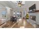 Entertaining game room with a fireplace, arcade, and doors to the outside at 296 Windemere Isle Rd, Statesville, NC 28677