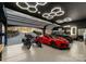 This garage features custom lighting, epoxy floors, and showcases a collection of cars and bikes at 296 Windemere Isle Rd, Statesville, NC 28677