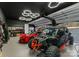 Modern garage with a red sports car, overhead lighting, and work benches at 296 Windemere Isle Rd, Statesville, NC 28677