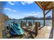 Personal watercraft docked in a covered boat slip with seating area overlooking the lake at 296 Windemere Isle Rd, Statesville, NC 28677