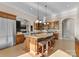 Spacious kitchen featuring a large island with seating, granite countertops, and stainless steel appliances at 296 Windemere Isle Rd, Statesville, NC 28677