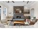 Cozy living room featuring a stone fireplace, comfortable seating, and natural light at 296 Windemere Isle Rd, Statesville, NC 28677