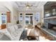 Bright living room with lake views, a stone fireplace, and comfortable seating at 296 Windemere Isle Rd, Statesville, NC 28677