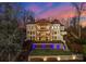 Elegant multi-story home featuring balconies, arched windows, and manicured landscaping at 296 Windemere Isle Rd, Statesville, NC 28677