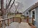 Back deck view overlooking a spacious, leaf-covered yard with mature trees at 3138 Morson St, Charlotte, NC 28208