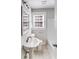 Cozy bathroom with a toilet, vanity, and shower/tub combo at 3138 Morson St, Charlotte, NC 28208