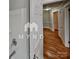 Bathroom featuring hardwood floors with an entrance to additional rooms at 3138 Morson St, Charlotte, NC 28208