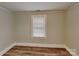 Cozy bedroom with neutral paint and wood-look flooring at 3138 Morson St, Charlotte, NC 28208