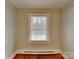 Cozy bedroom with a window providing natural light and classic hardwood floors at 3138 Morson St, Charlotte, NC 28208