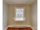 Simple bedroom with hardwood floors and neutral walls and window at 3138 Morson St, Charlotte, NC 28208