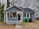 Charming bungalow with a covered porch and a well-maintained front yard at 3138 Morson St, Charlotte, NC 28208