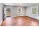 Bright living room featuring hardwood floors and two windows offering great natural light at 3138 Morson St, Charlotte, NC 28208