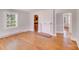 Inviting living room featuring hardwood floors, a fireplace, and large window for natural light at 3138 Morson St, Charlotte, NC 28208