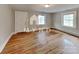 Bright living room with hardwood floors and natural light from two windows at 3138 Morson St, Charlotte, NC 28208