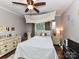 Bedroom showcasing hardwood floors, ceiling fan and natural lighting through a window at 3300 Chancellor Ln, Monroe, NC 28110