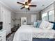 Bedroom with hardwood floors, ceiling fan, window with curtains, and a vanity at 3300 Chancellor Ln, Monroe, NC 28110