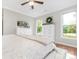 Comfortable bedroom featuring hardwood floors, ceiling fan, and dresser at 3300 Chancellor Ln, Monroe, NC 28110