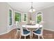 Cozy dining room with wood floors, chandelier, and windows offering great views at 3300 Chancellor Ln, Monroe, NC 28110