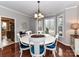 Spacious dining area with a round table, six chairs and abundant natural light at 3300 Chancellor Ln, Monroe, NC 28110