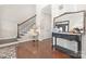Inviting foyer with wood floors, staircase, and decorative mirror, creating a welcoming entrance at 3300 Chancellor Ln, Monroe, NC 28110
