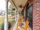 Inviting front porch with rocking chairs and black shutters, great for relaxing at 3300 Chancellor Ln, Monroe, NC 28110