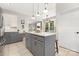 Spacious kitchen featuring an island with seating, granite countertops, and ample cabinet space at 3300 Chancellor Ln, Monroe, NC 28110