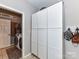 Laundry room with abundant storage cabinets and a view into the wash and dry area at 3300 Chancellor Ln, Monroe, NC 28110