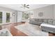 Cozy living room featuring hardwood floors, neutral decor, and ample natural light at 3300 Chancellor Ln, Monroe, NC 28110