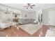 Inviting living room boasts hardwood floors, a comfortable gray sectional, and an open layout at 3300 Chancellor Ln, Monroe, NC 28110