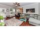 Comfortable living room with a plush sectional sofa, light gray walls and dark floors at 3300 Chancellor Ln, Monroe, NC 28110