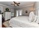 Main bedroom featuring neutral décor, a double door entry, and a ceiling fan at 3300 Chancellor Ln, Monroe, NC 28110