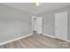 Bedroom with two closets and wood-look flooring at 3301 10Th Ne Ave, Conover, NC 28613