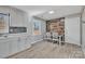 Eat-in kitchen with gray cabinets and wood-look walls at 3301 10Th Ne Ave, Conover, NC 28613