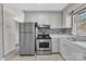 Modern kitchen with stainless steel appliances and gray cabinets at 3301 10Th Ne Ave, Conover, NC 28613