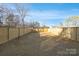 Large, private backyard fully enclosed with a wooden fence and expansive grassy area at 3308 Polk And White Rd, Charlotte, NC 28269