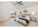 Bright bedroom with vaulted ceiling, sliding glass doors, and stylish decor at 3308 Polk And White Rd, Charlotte, NC 28269