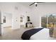 Bright bedroom with vaulted ceilings, a door to the outside, a modern console, and neutral colors at 3312 Polk And White Rd, Charlotte, NC 28269