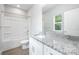 Bathroom featuring a shower and bath, a vanity with granite countertop and tile flooring at 338 Hudson St, Shelby, NC 28150