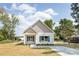 Charming single-story home with vinyl siding, blue shutters, and a well-manicured front yard at 338 Hudson St, Shelby, NC 28150