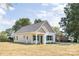 Well-maintained home featuring a charming facade, light-colored vinyl siding, and manicured landscaping at 338 Hudson St, Shelby, NC 28150