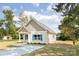 Well-maintained home featuring a charming facade, light-colored vinyl siding, and manicured landscaping at 338 Hudson St, Shelby, NC 28150