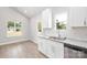 Well-lit kitchen featuring granite countertops, stainless steel appliances, and ample cabinet space at 338 Hudson St, Shelby, NC 28150