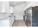 Modern kitchen featuring white cabinets, stainless steel appliances and granite countertops at 338 Hudson St, Shelby, NC 28150