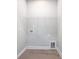 Functional laundry room with overhead shelving at 338 Hudson St, Shelby, NC 28150