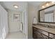 Bright bathroom featuring a shower, vanity, tiled floors, and a framed mirror at 3723 Annlin Ave, Charlotte, NC 28209