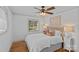 Bedroom with a large window and a comfortable bed with stylish pillows and bedside lamps at 3723 Annlin Ave, Charlotte, NC 28209