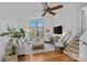 Bright living room with a large window, hardwood floors, and cozy seating at 3723 Annlin Ave, Charlotte, NC 28209